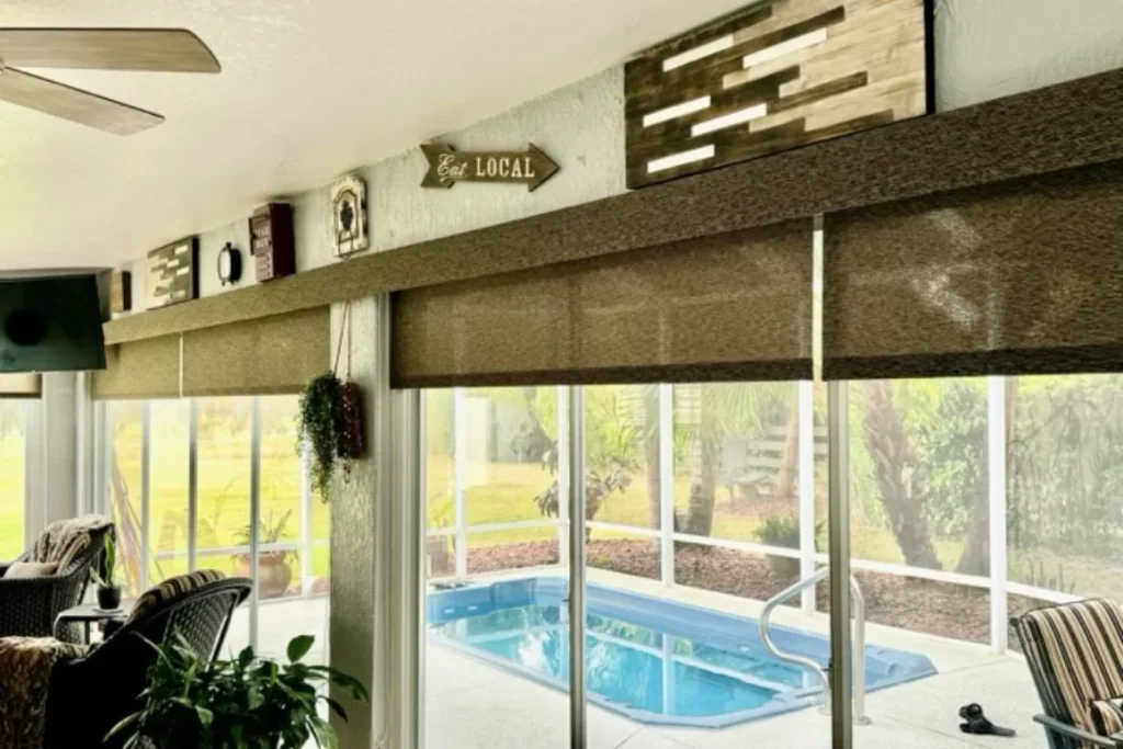 Solar shades on sliding glass doors overlooking a pool lanai in a Stone Crest home, Summerfield FL